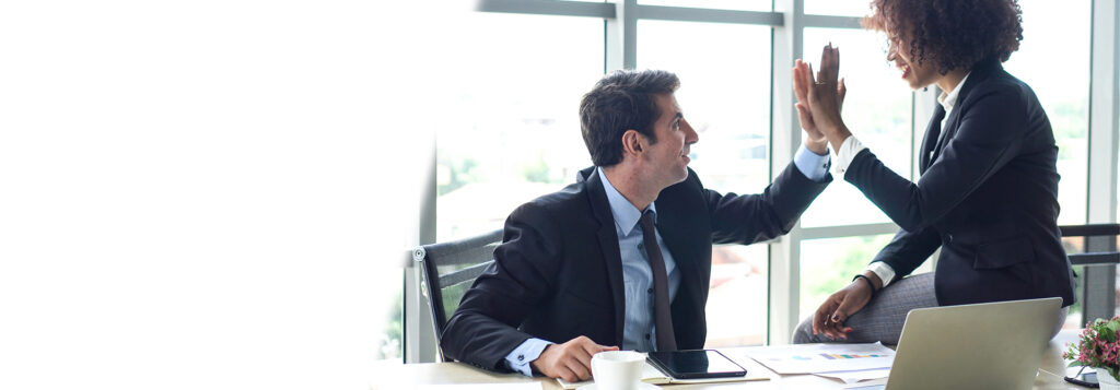 Hispanic and black interracial colleague high five congratulate work